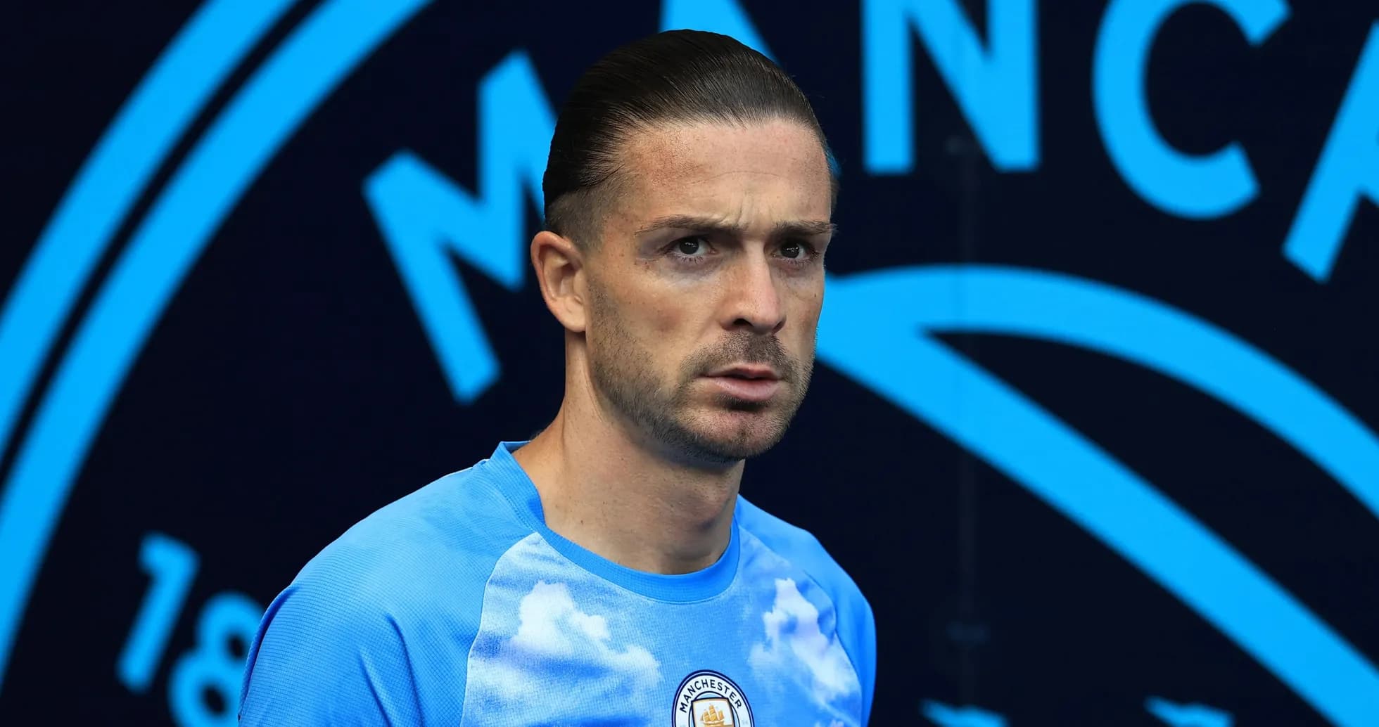 Player in Manchester City training kit at stadium