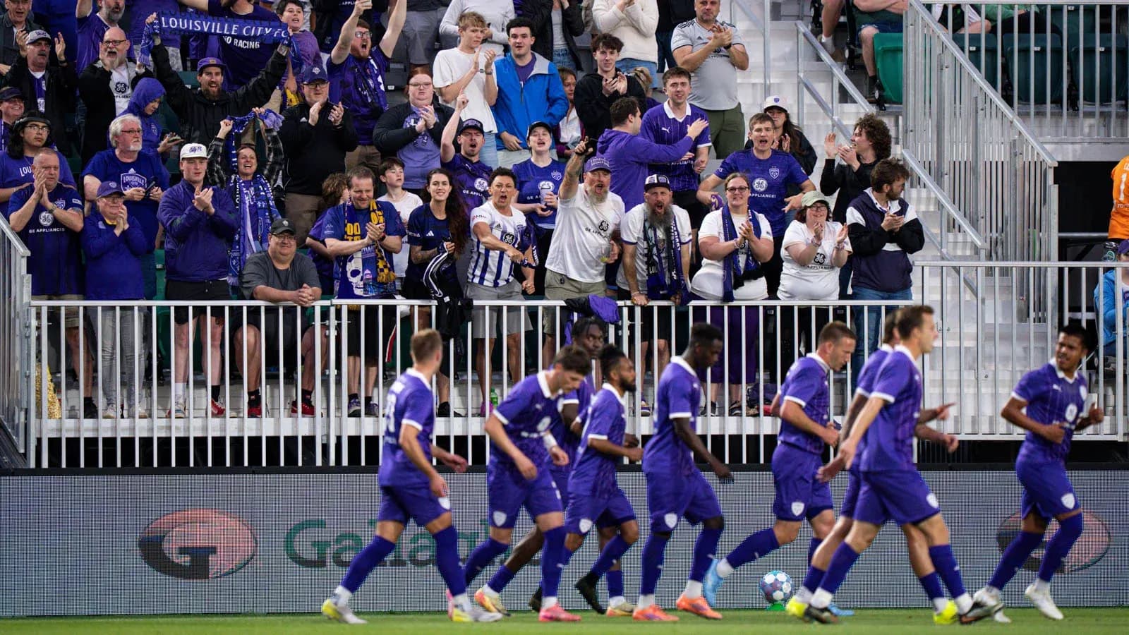 Louisville City fans celebrating during match