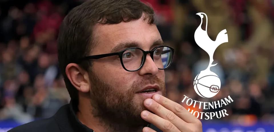 Man with glasses deep in thought at match