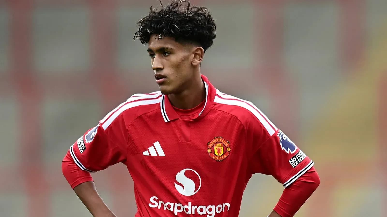 Player wearing Manchester United jersey on the field