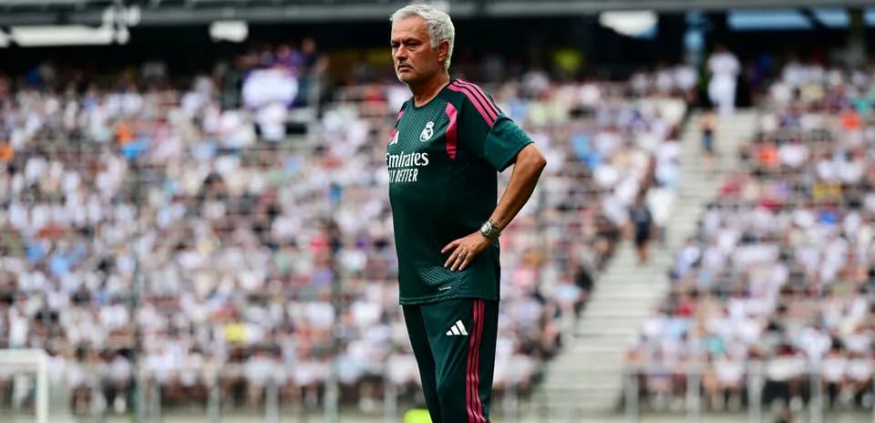 Coach observing match from the sidelines