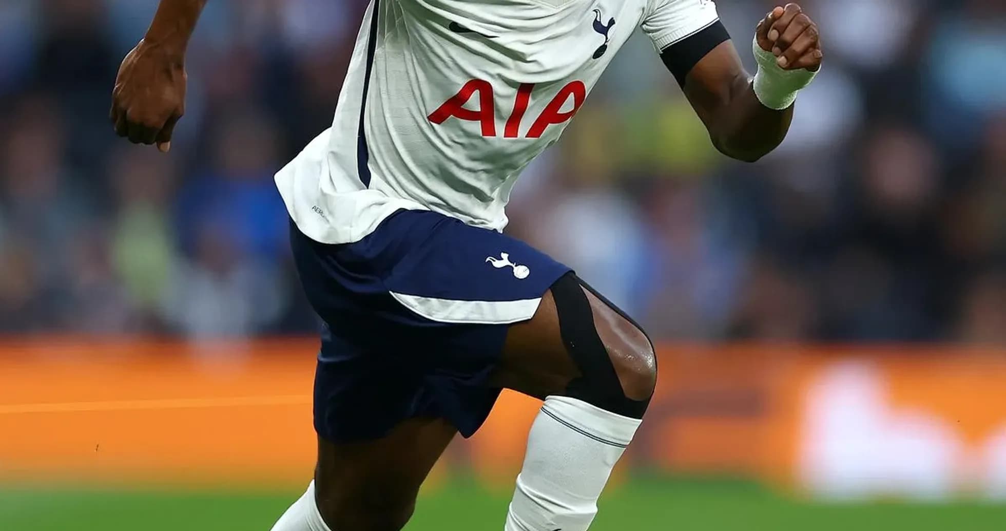Player running towards the ball during match