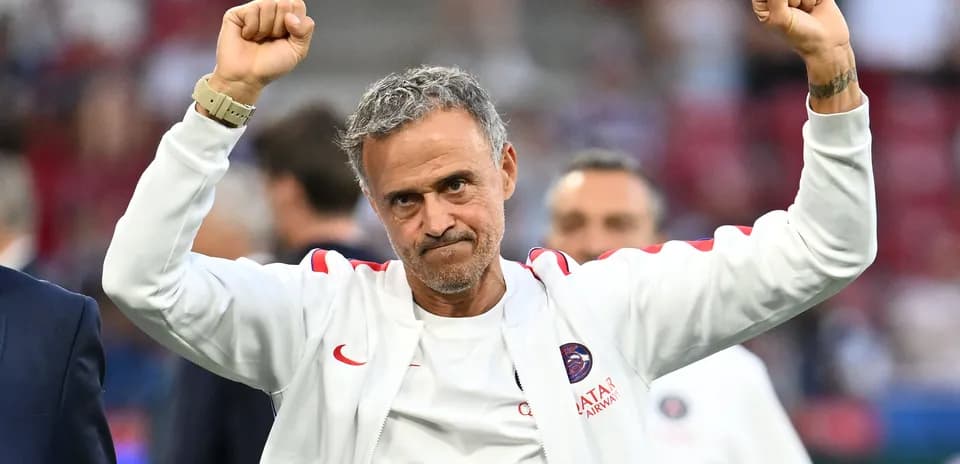 Coach celebrating with raised fists after match