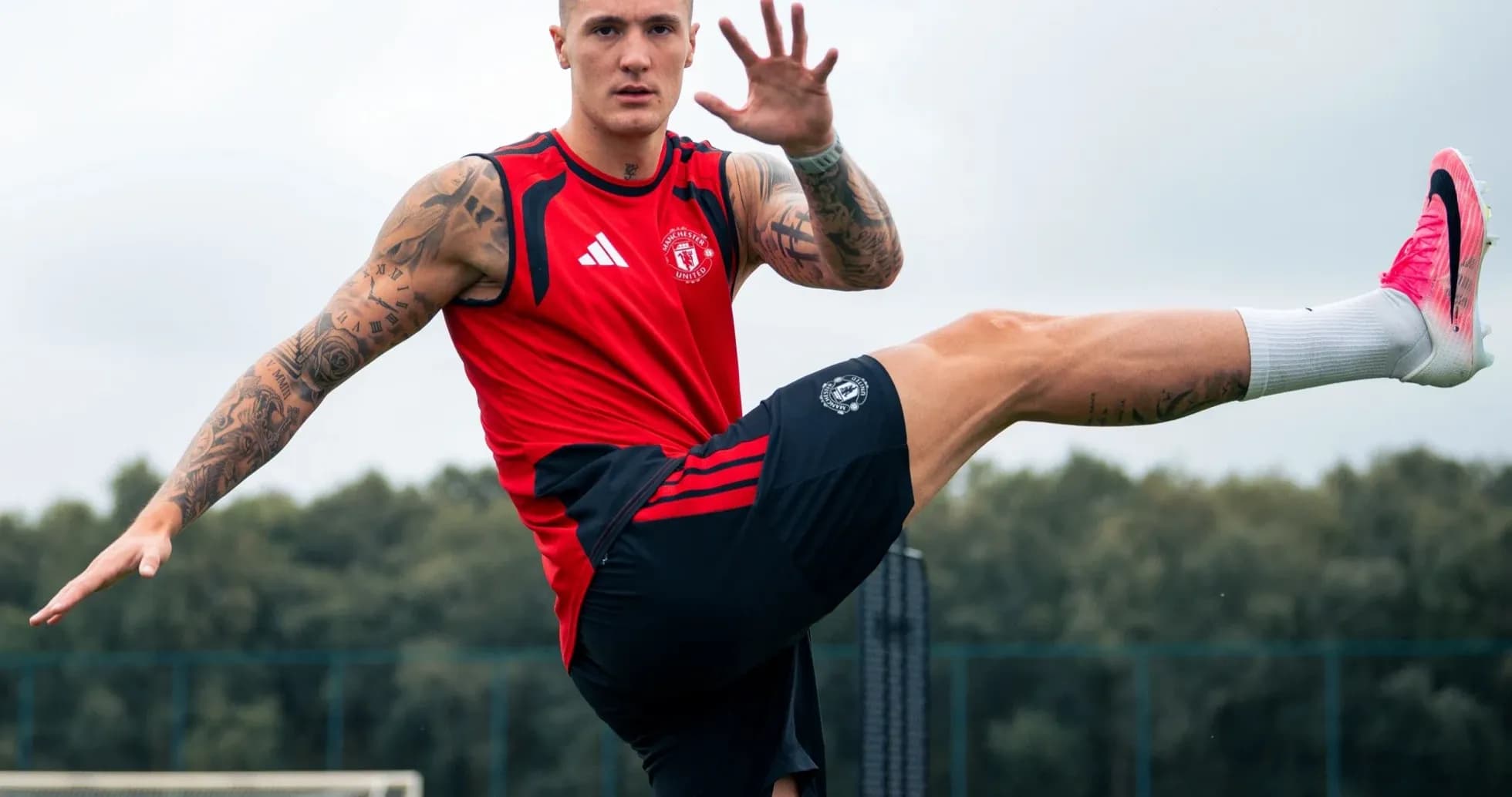 Player training with leg raised at practice session
