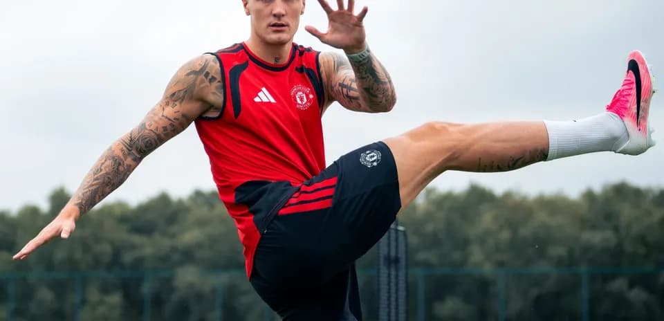 Player training with leg raised at practice session