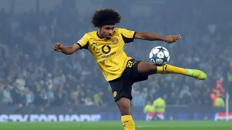 Player kicking a soccer ball during a match
