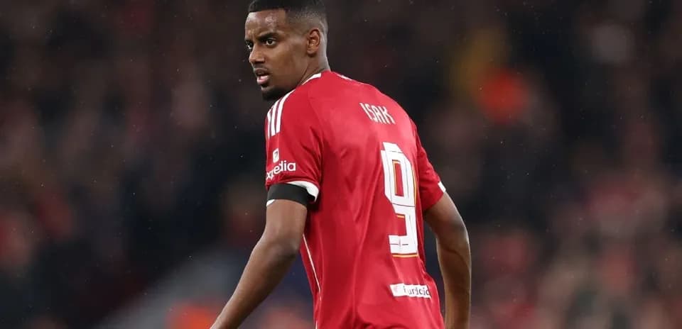 Player in red jersey turning during match