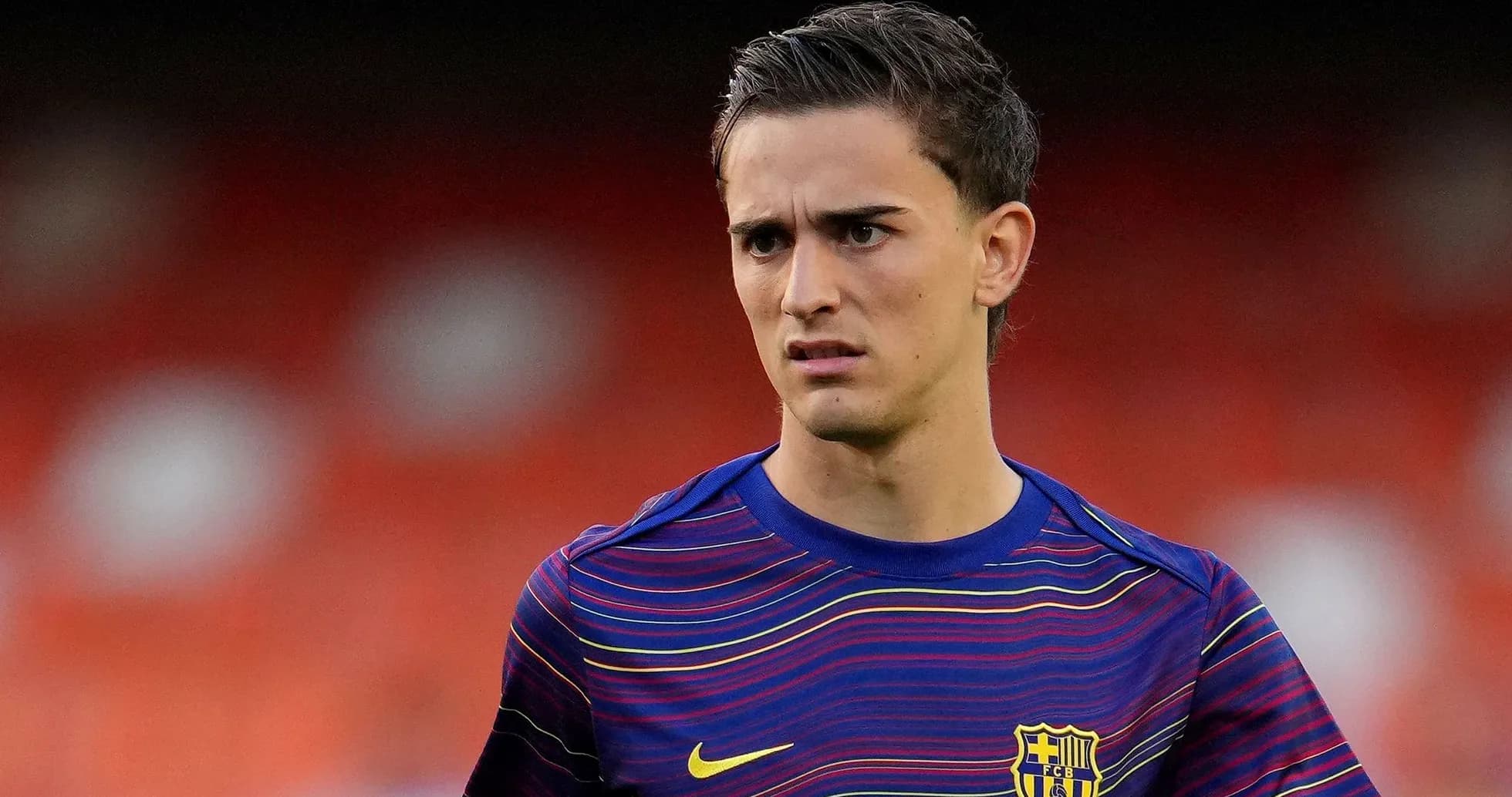 Player in FC Barcelona training kit on field
