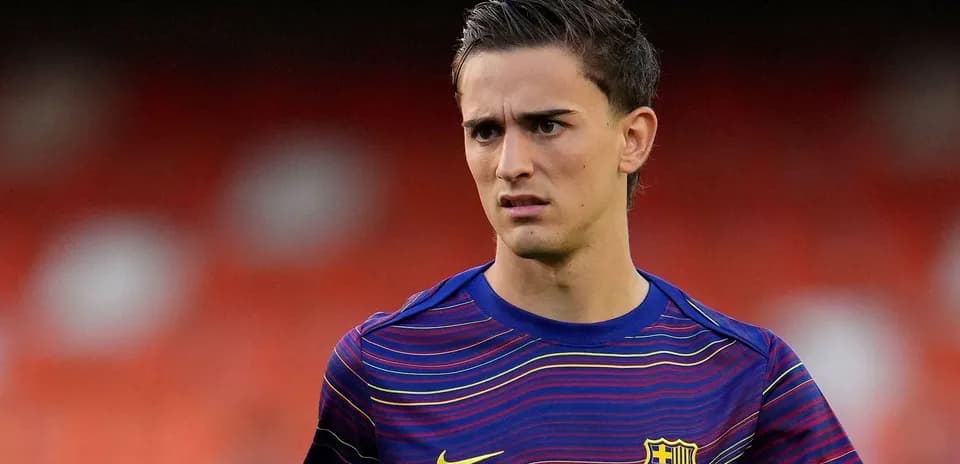 Player in FC Barcelona training kit on field