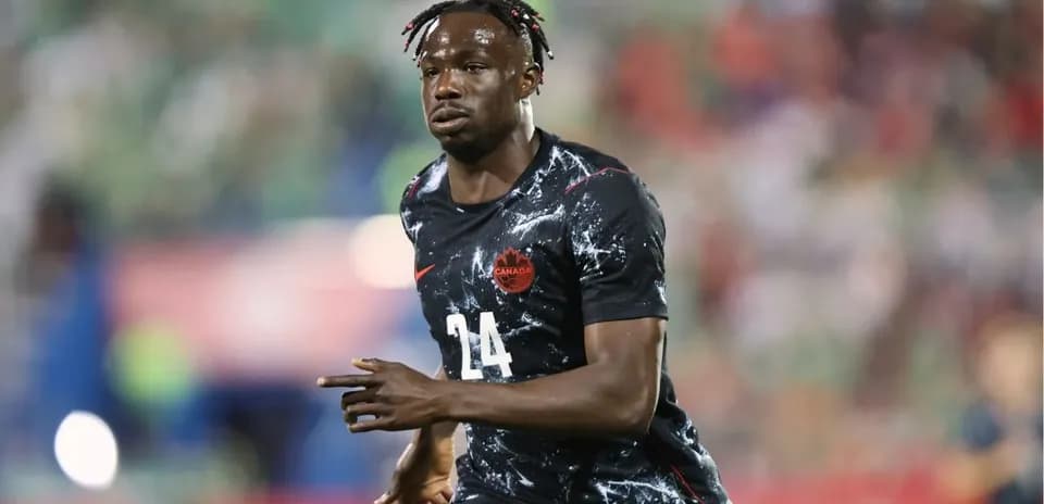 Player in Canada jersey running on the field