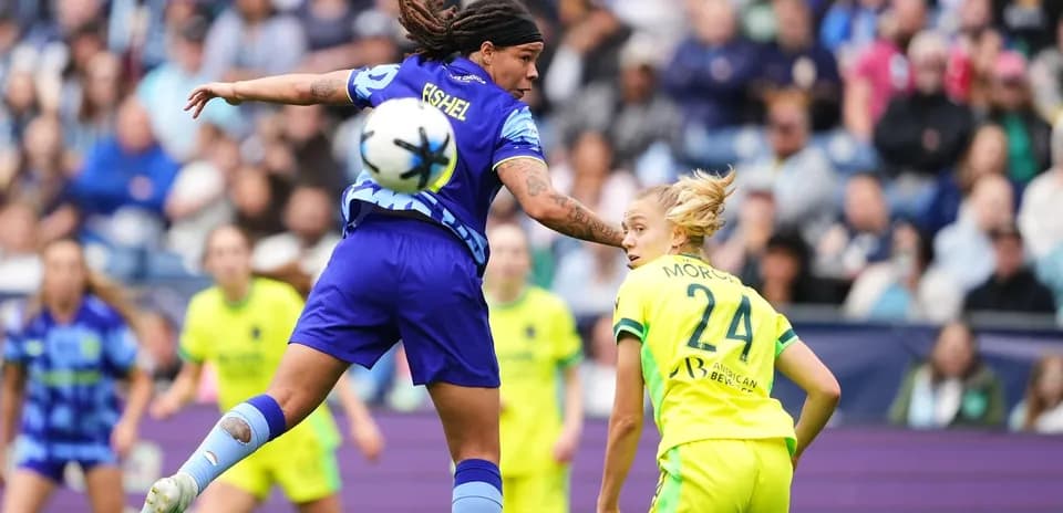 Players competing for the ball during match