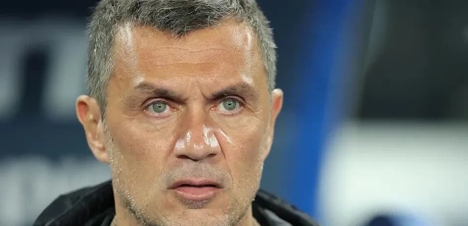 Coach looking on during a match in stadium