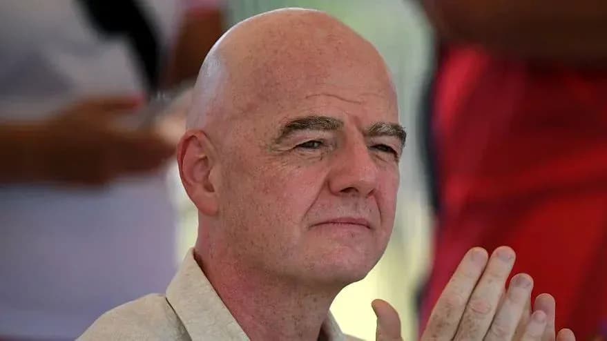 Man with bald head sitting and clapping hands