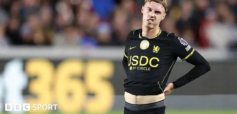 Player adjusting jersey during match on field