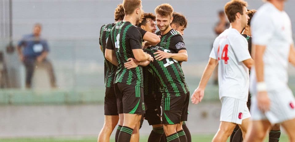 Players celebrating a goal during MLS Next Pro match