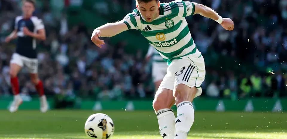 Player kicking ball during match on field