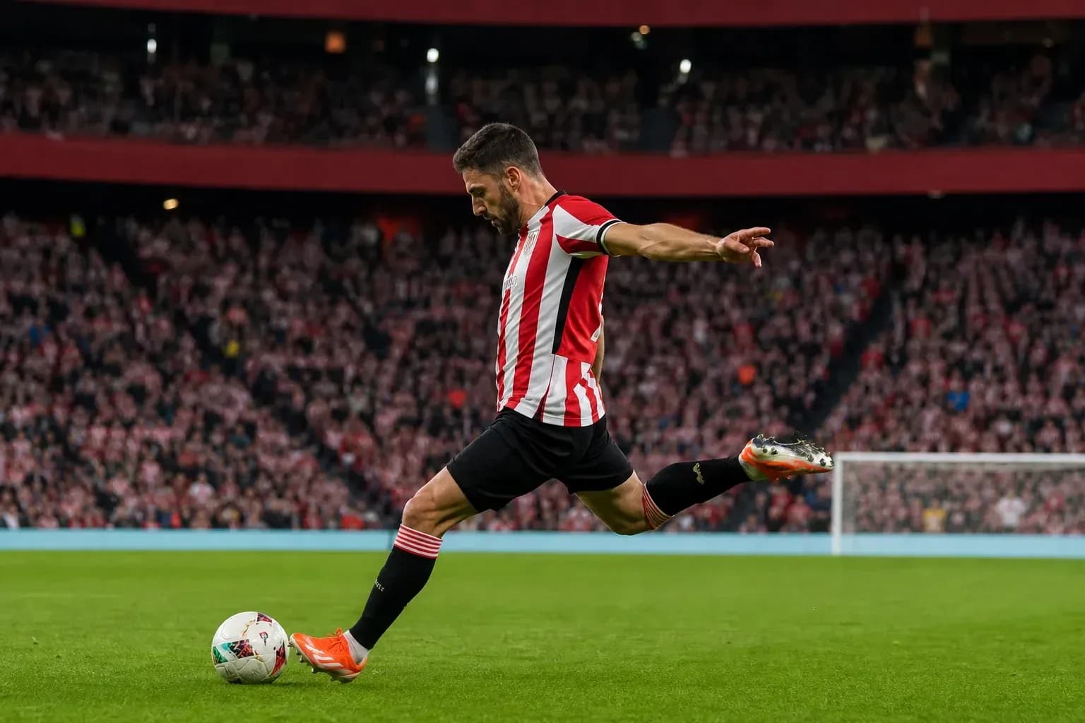 Player taking a corner kick in a stadium