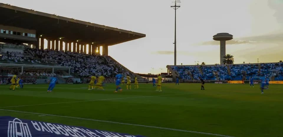 Players in yellow and blue competing on the field