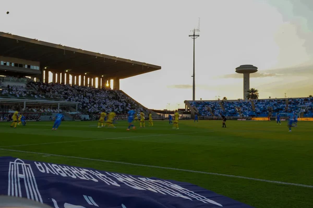 Players in yellow and blue competing on the field