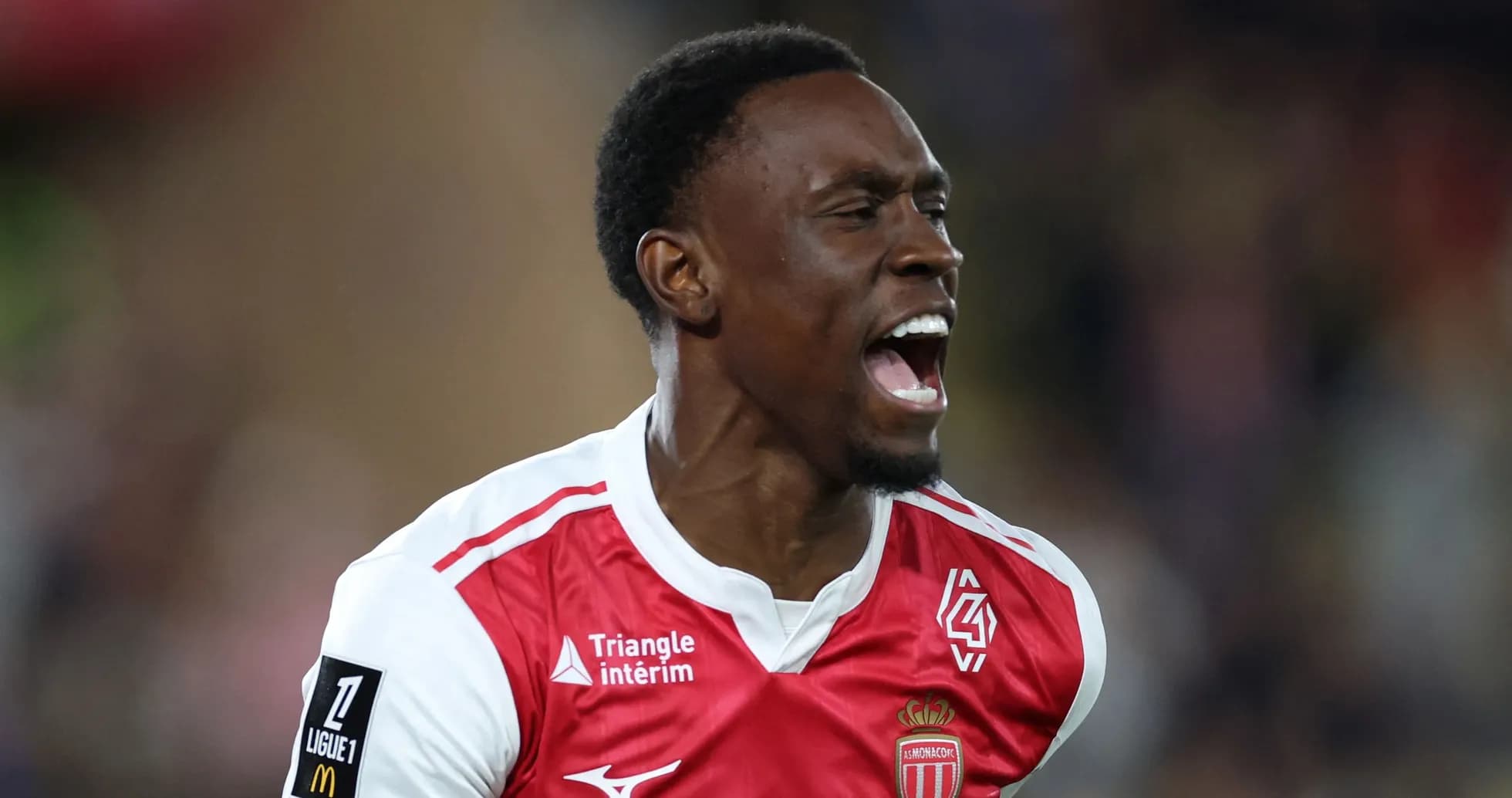Player celebrating a goal in AS Monaco jersey
