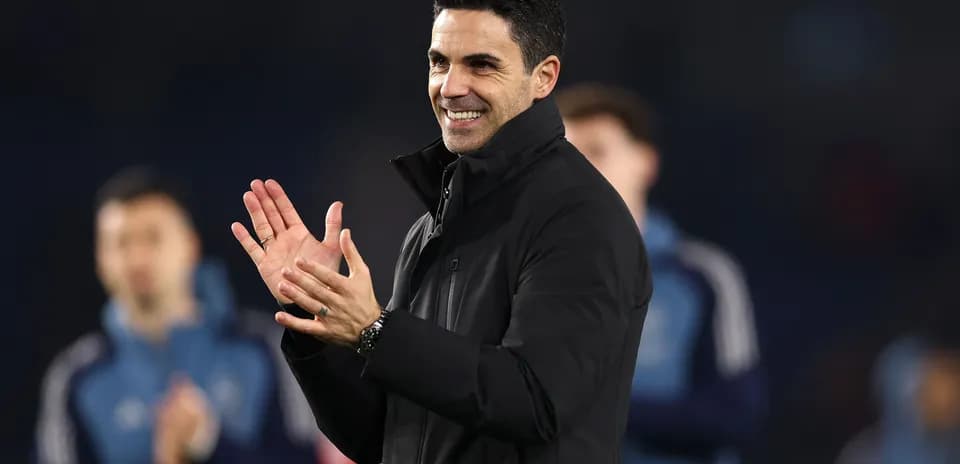 Coach applauding during match warm-up session