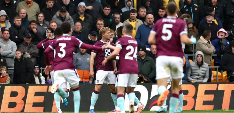 Burnley players celebrating during Premier League match