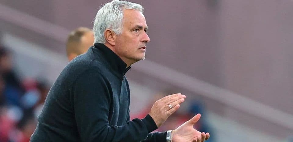 Coach gesturing from the sidelines during match