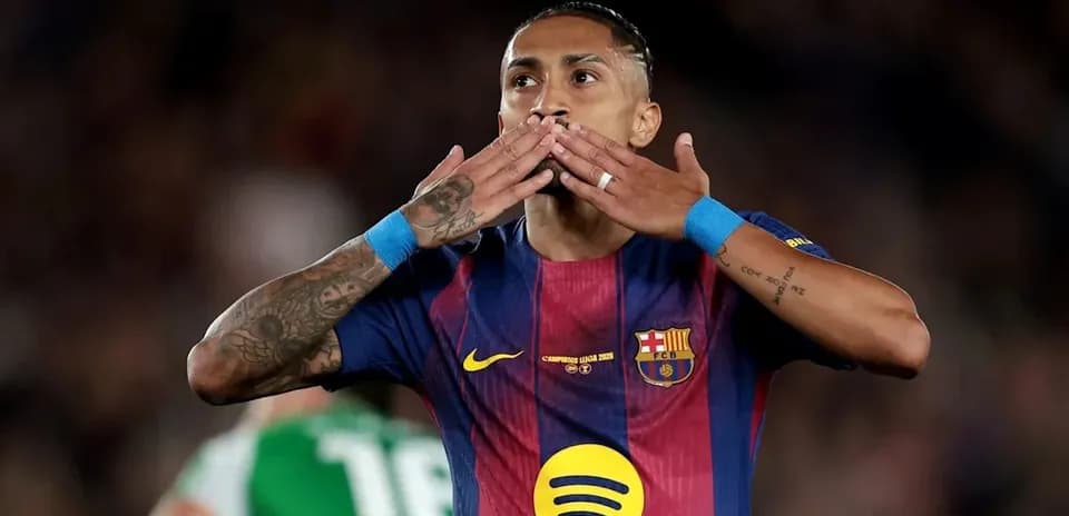 Player celebrating with hand gestures on field