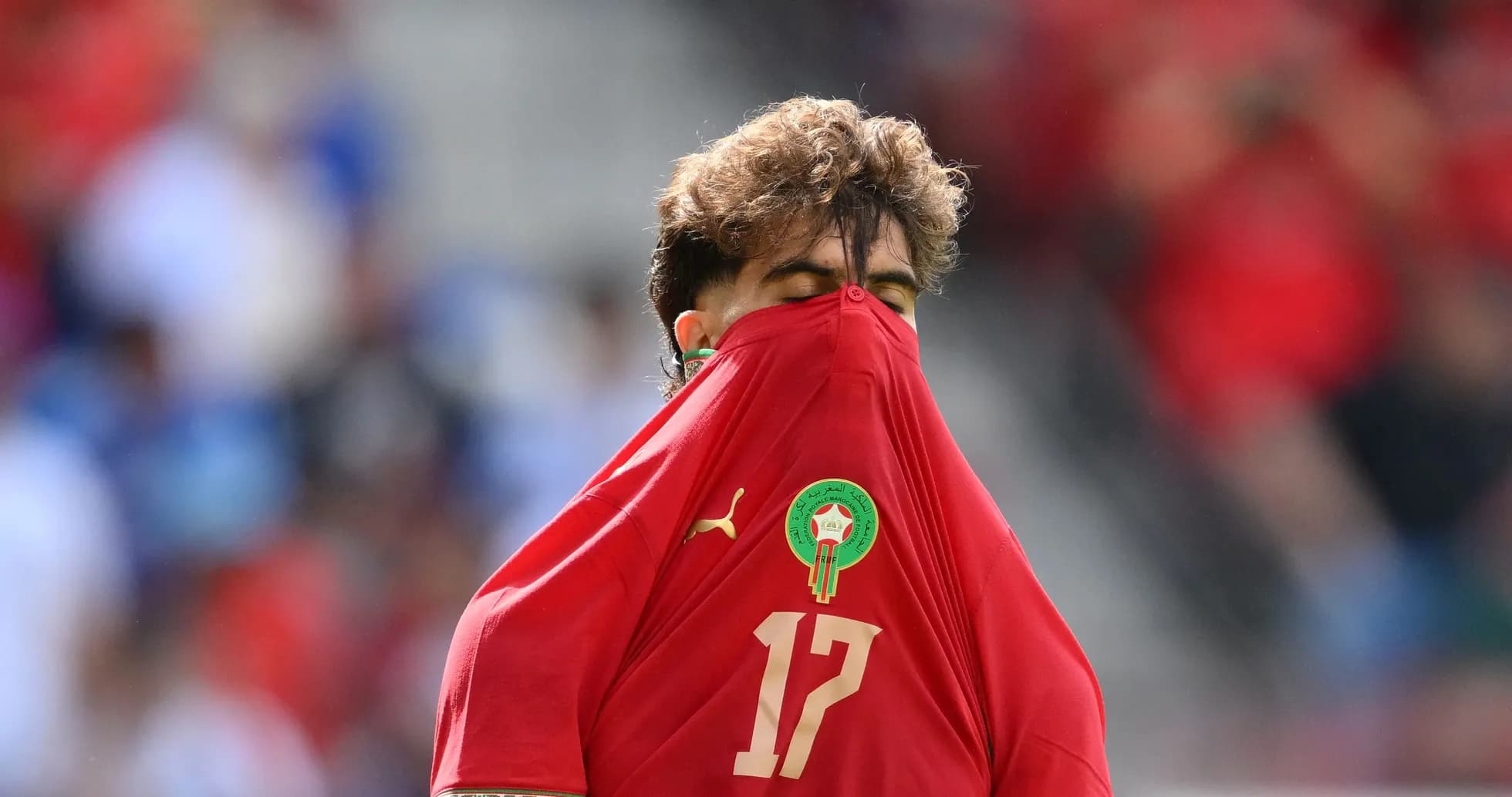 Player with shirt over face during match