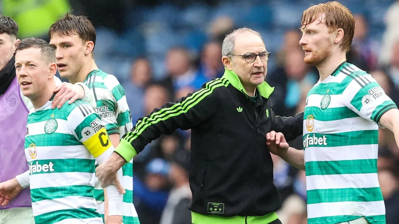 Celtic players and manager interacting during match