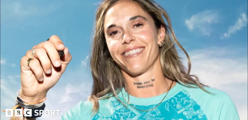 Athlete smiling and holding a marker in hand