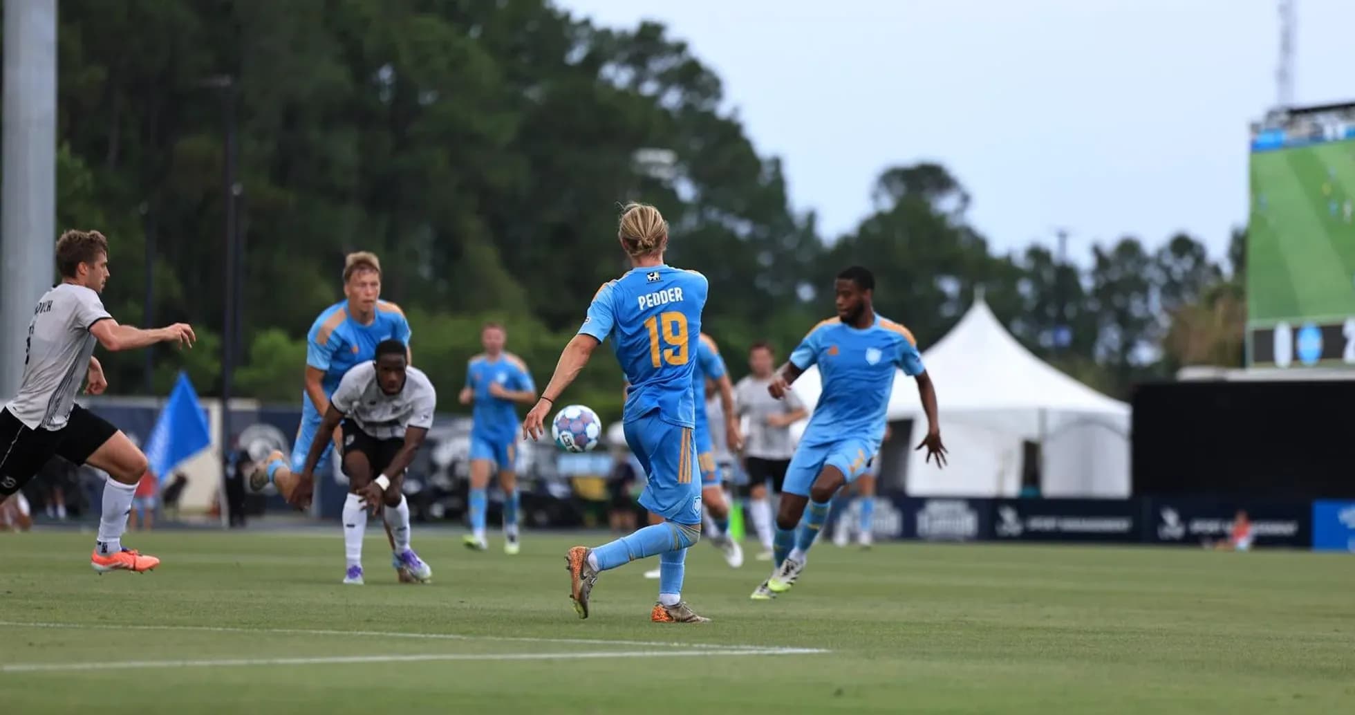Player 19 passing the ball in match