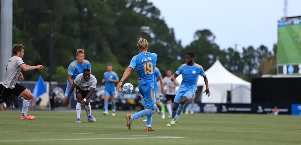 Player 19 passing the ball in match