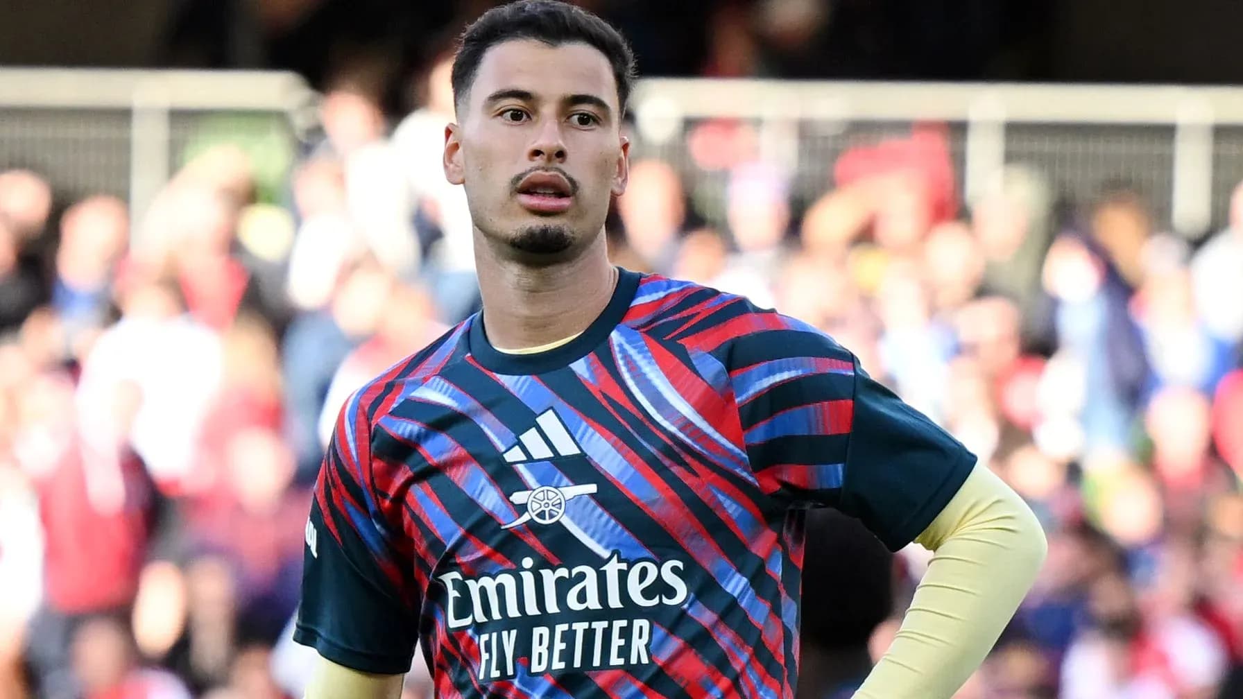 Goalkeeper warming up in colorful training kit