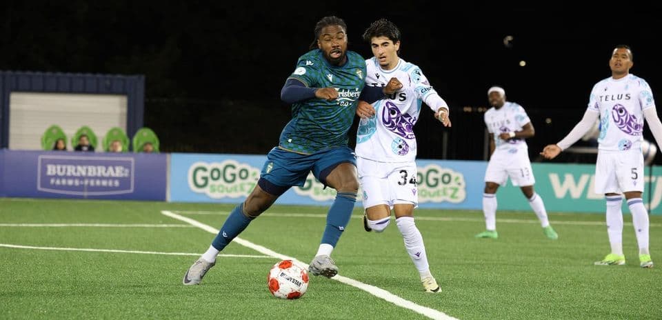 Pacific FC player dribbling past York United opponent