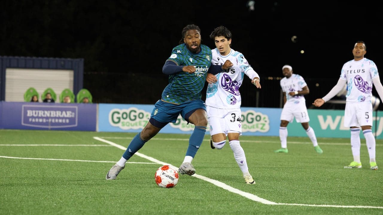 Pacific FC player dribbling past York United opponent