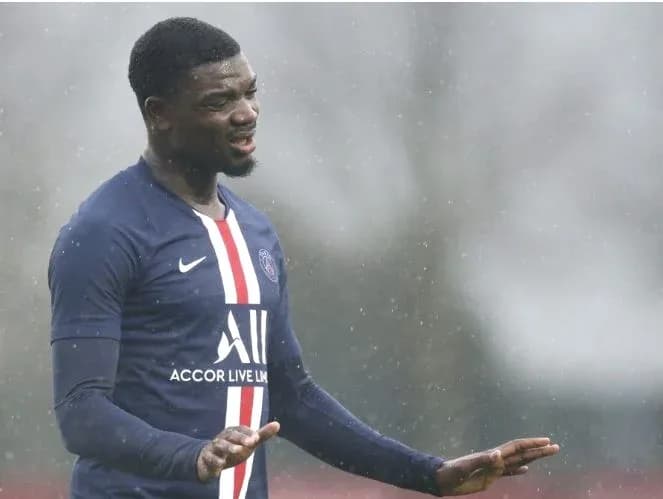 Player gesturing during training session in rain