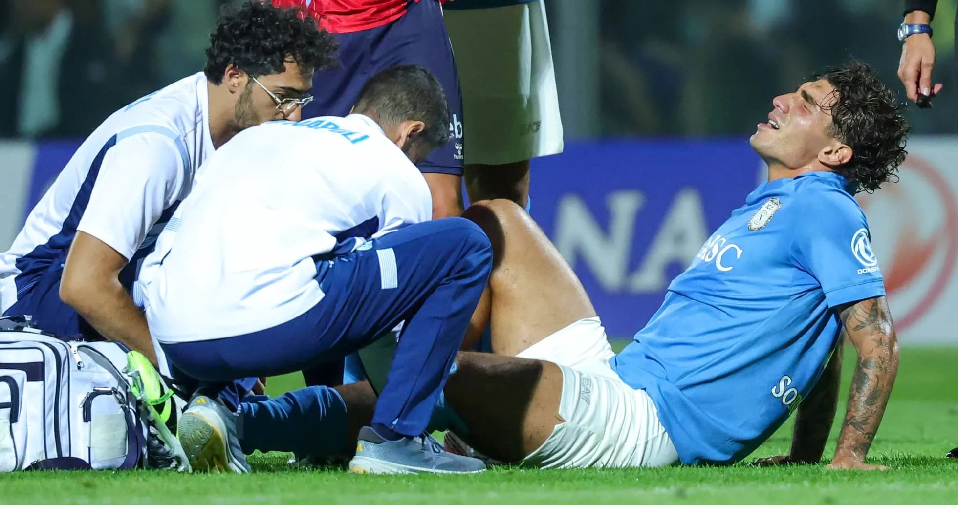 Player receiving medical attention for injury on field