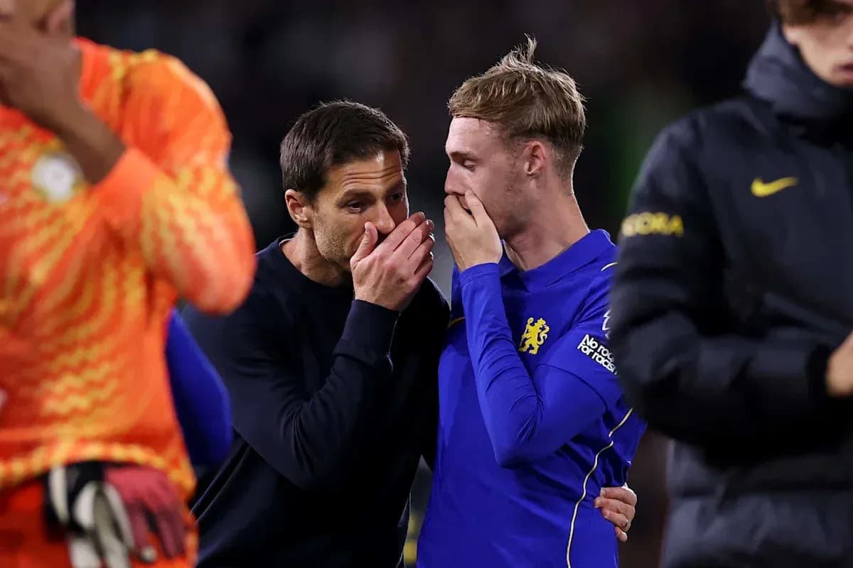 Coach speaking to player after the match