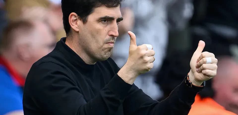 Coach giving thumbs up from the sidelines