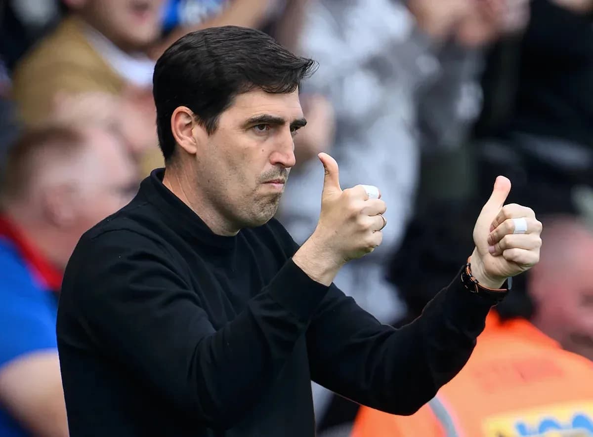 Coach giving thumbs up from the sidelines