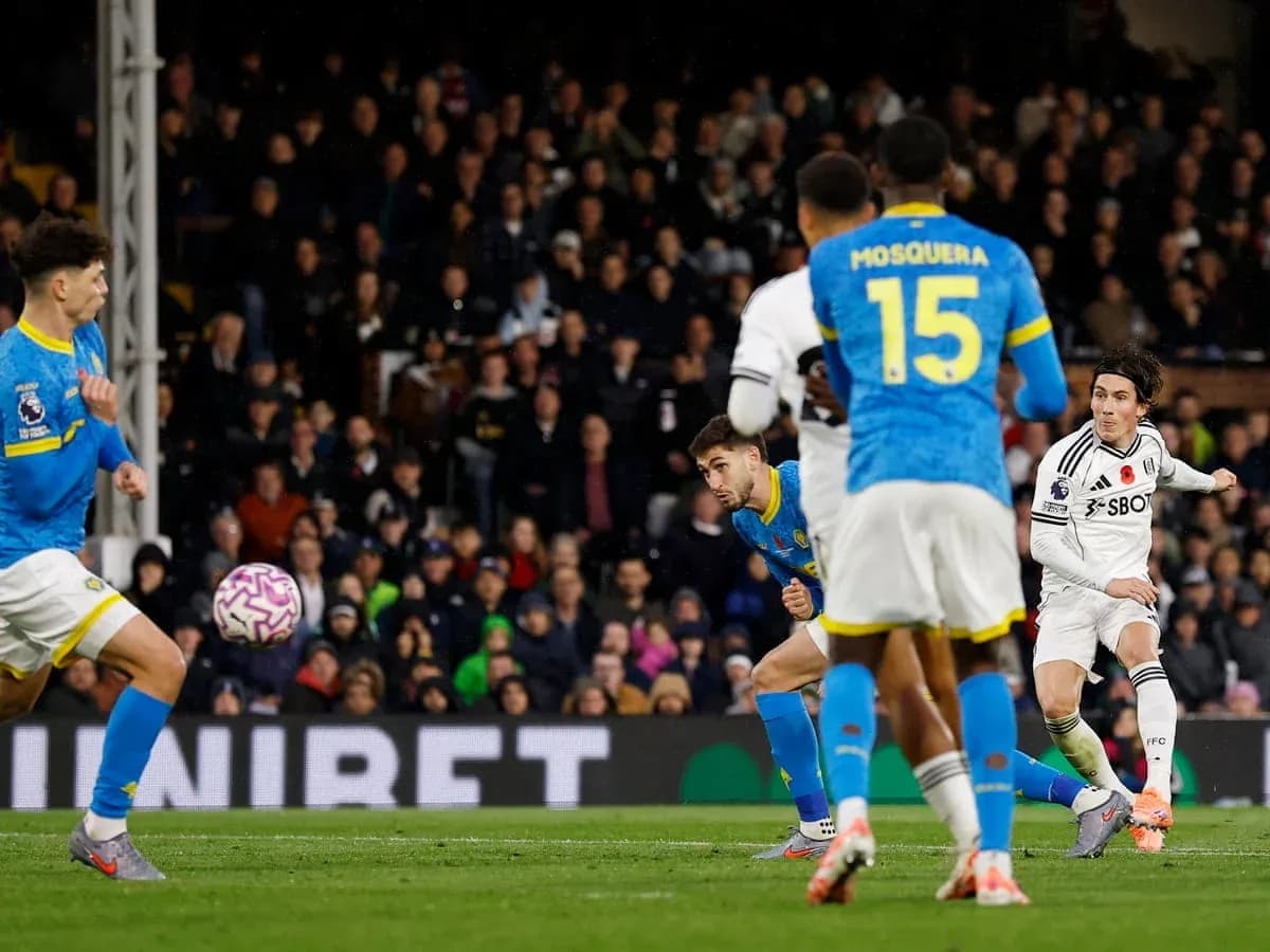 Fulham player taking a shot during match