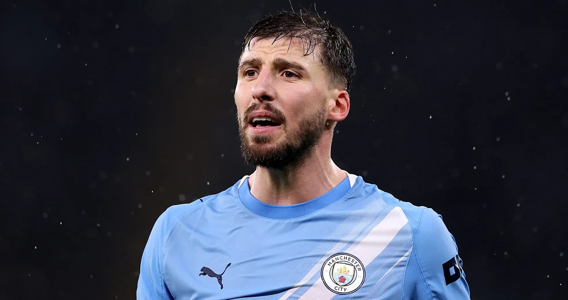 Manchester City player speaking during a match