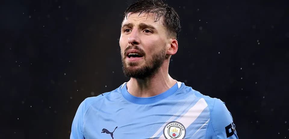 Manchester City player speaking during a match