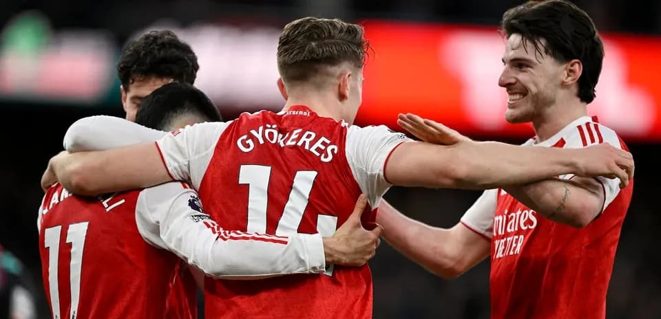 Arsenal players celebrating a goal together