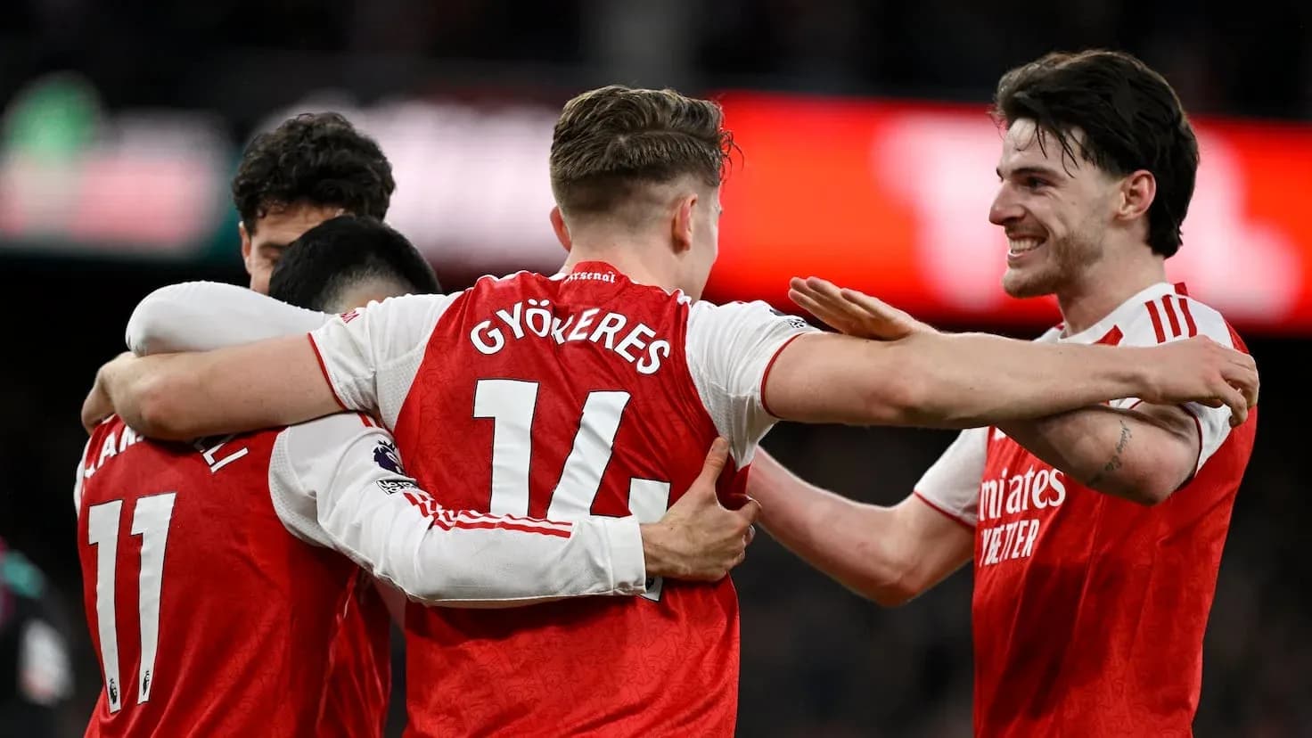 Arsenal players celebrating a goal together