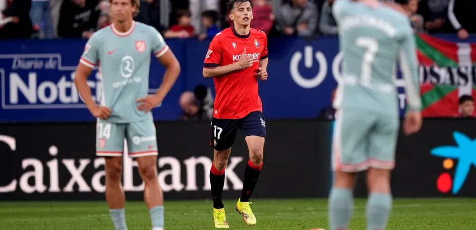 Osasuna player in action against Atletico Madrid