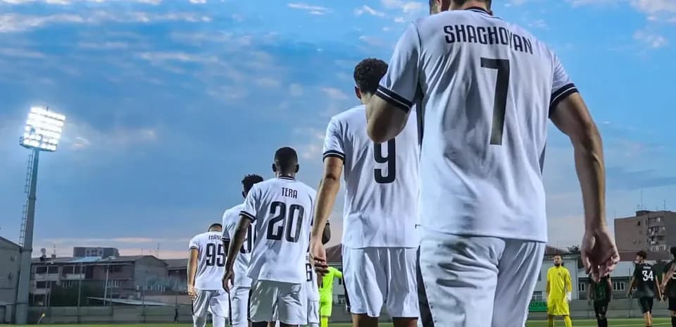 Players walking onto the field for UEFA match