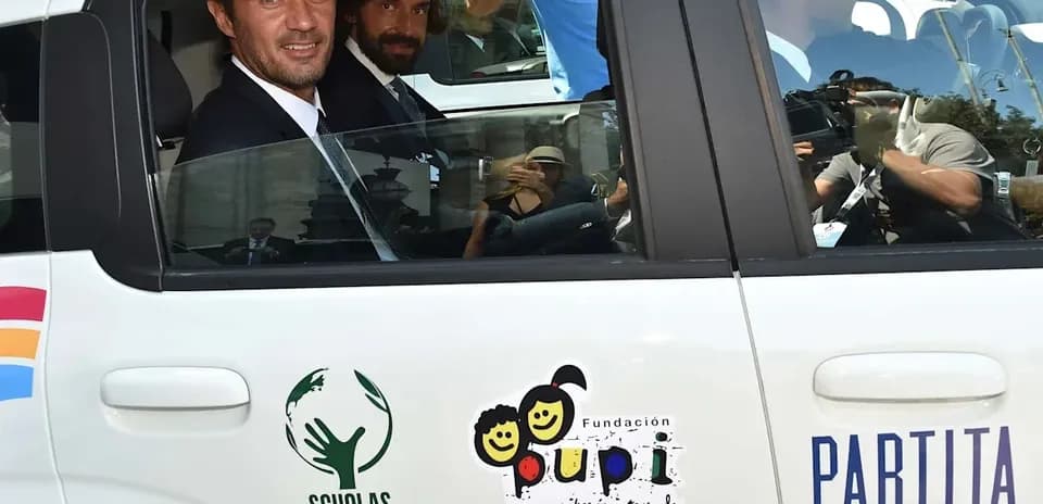 Two men in suits inside a taxi cab