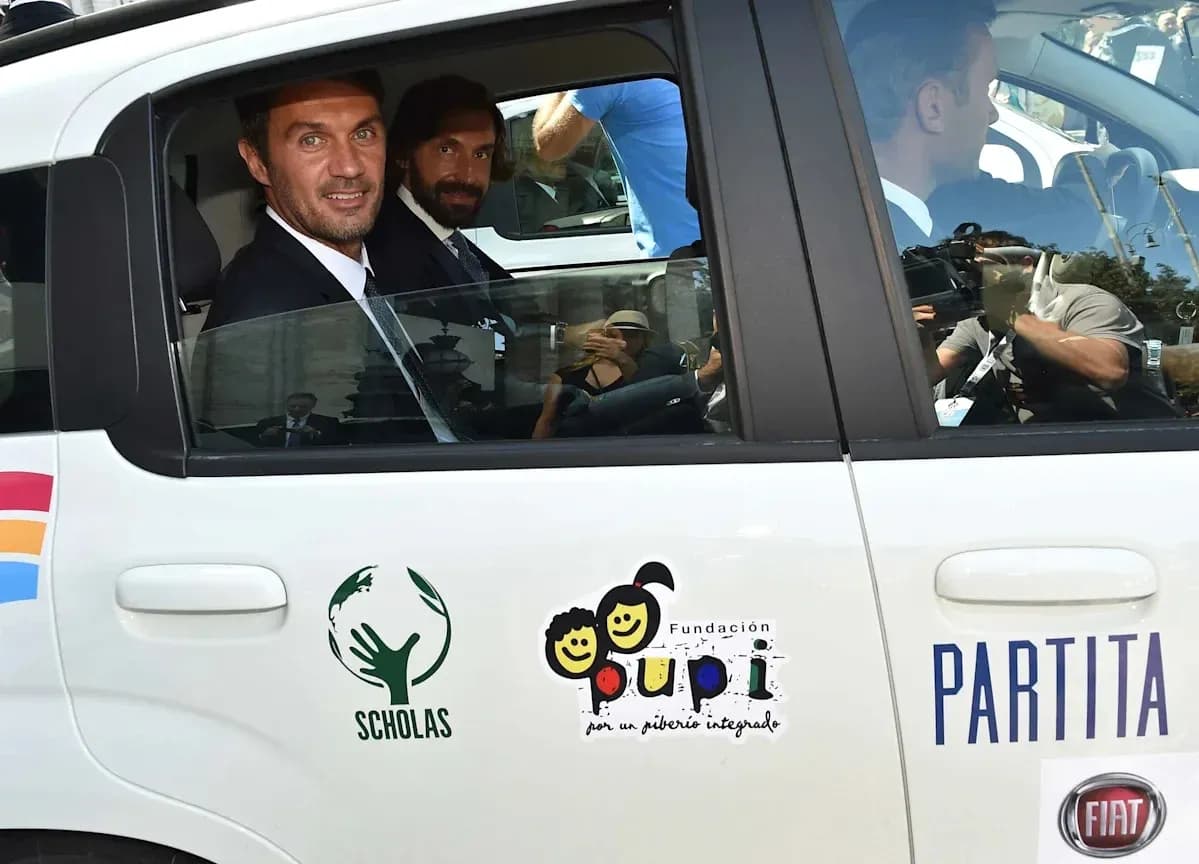 Two men in suits inside a taxi cab